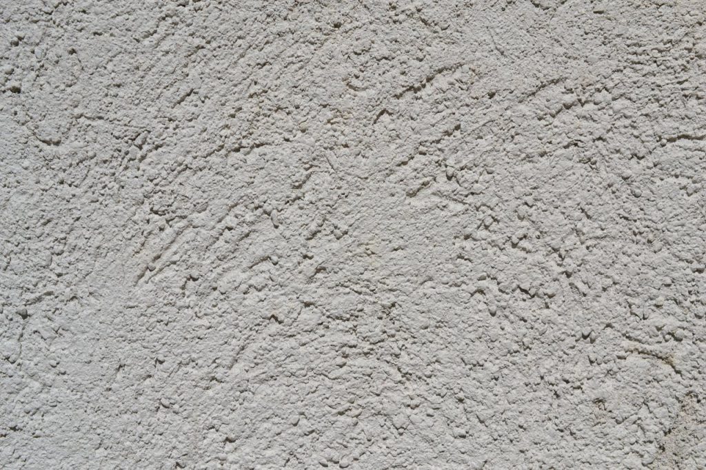 gray-unfinished-plaster-wall-12901948 Close-up of a light gray stucco wall texture, ideal for backgrounds.